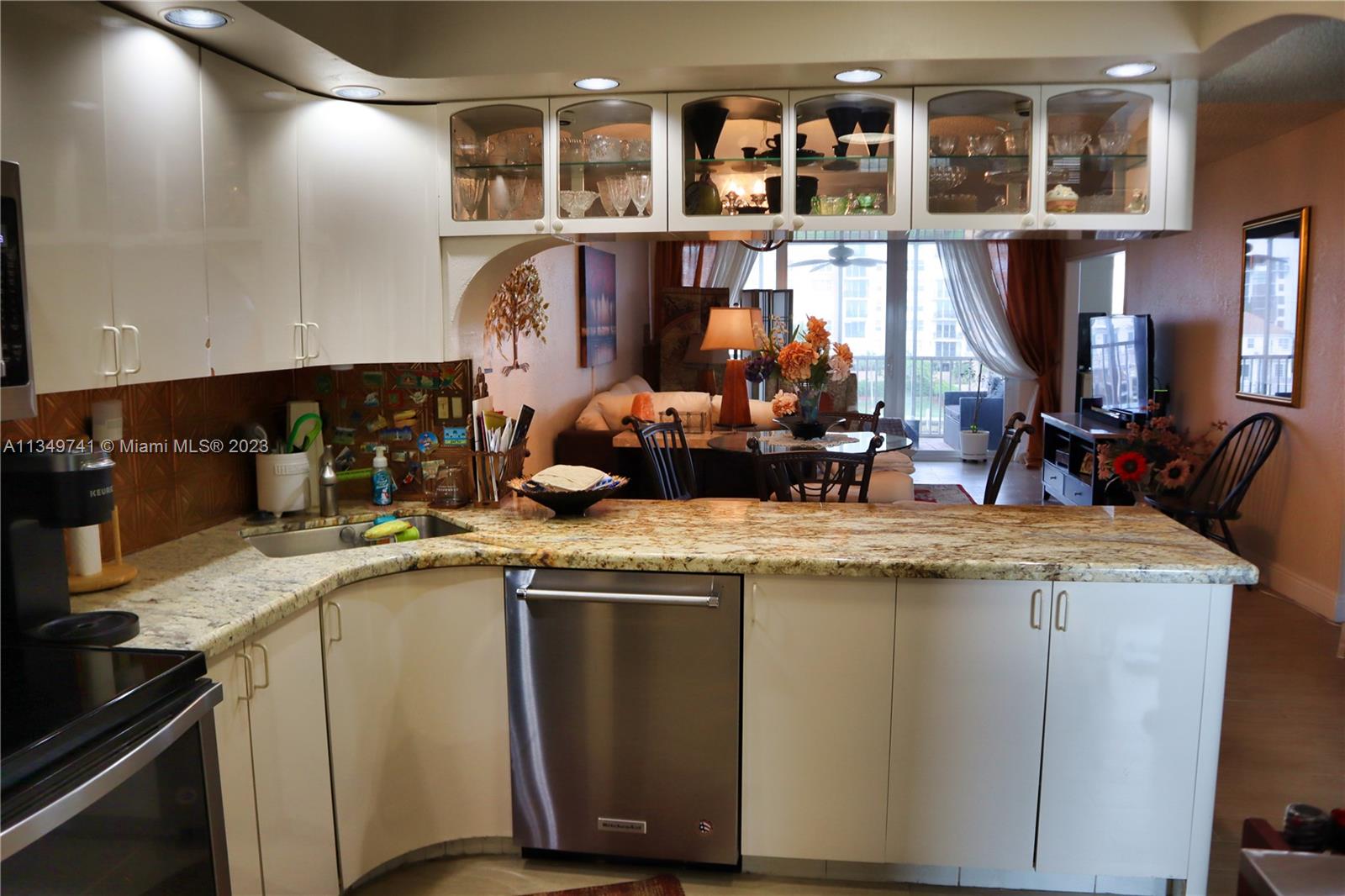 Lighthouse Point Lighthouse Point, FL 33064 - Photo 6 of 52 a kitchen with stainless steel appliances granite countertop a sink and a stove