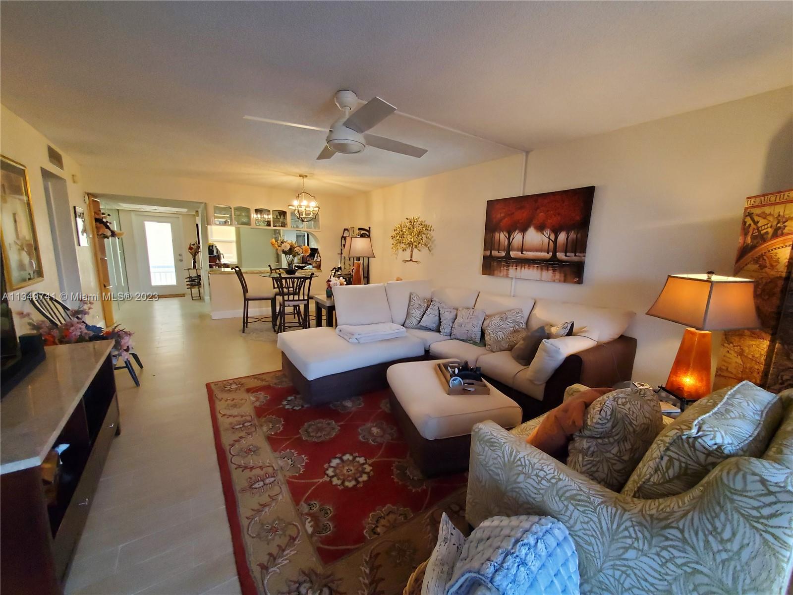 Lighthouse Point Lighthouse Point, FL 33064 - Photo 10 of 52 a living room with furniture and wooden floor
