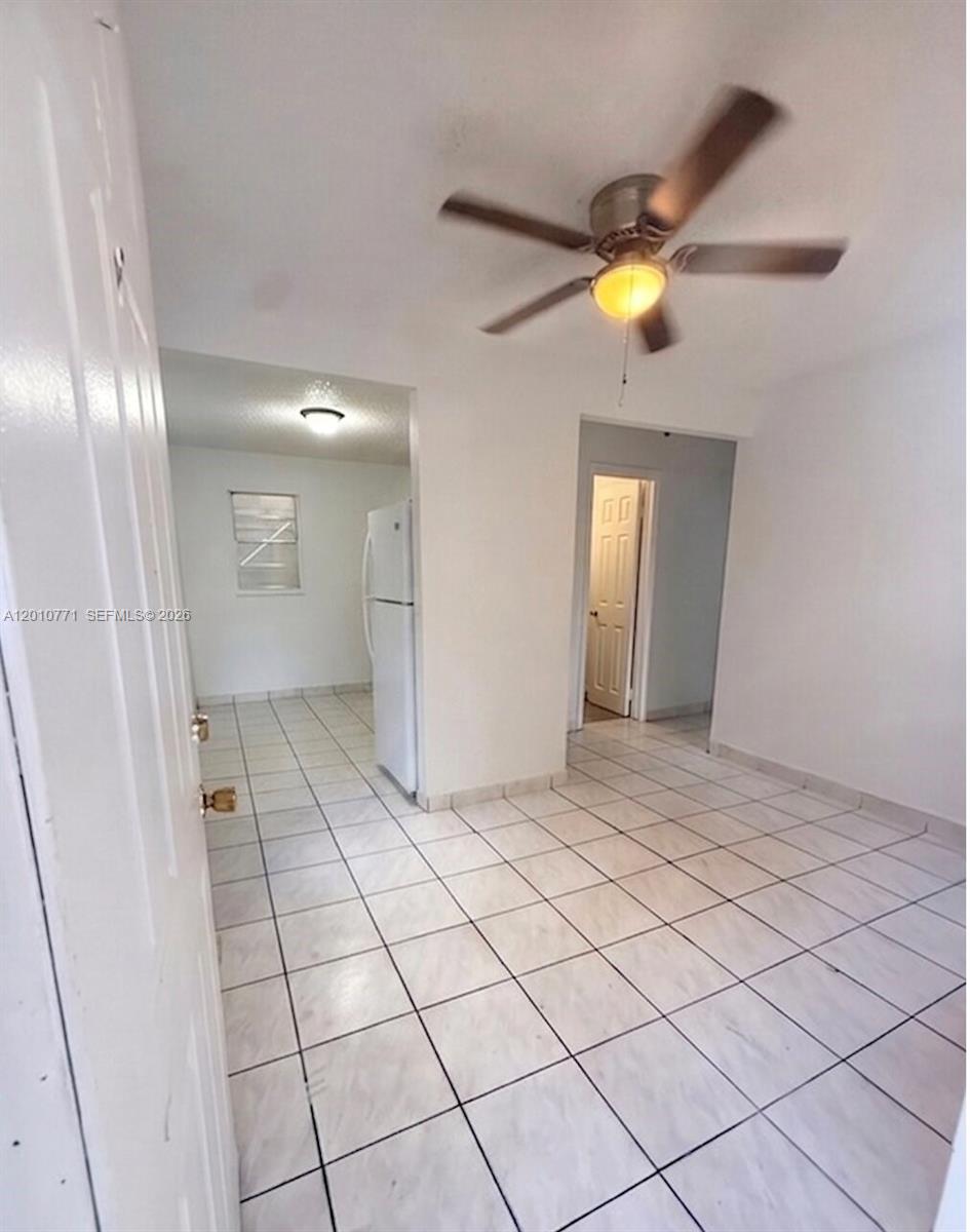 718 Southwest 11th Avenue, Unit 5 Miami, FL 33130 - Photo 2 of 6 a view of an entryway and a chandelier fan
