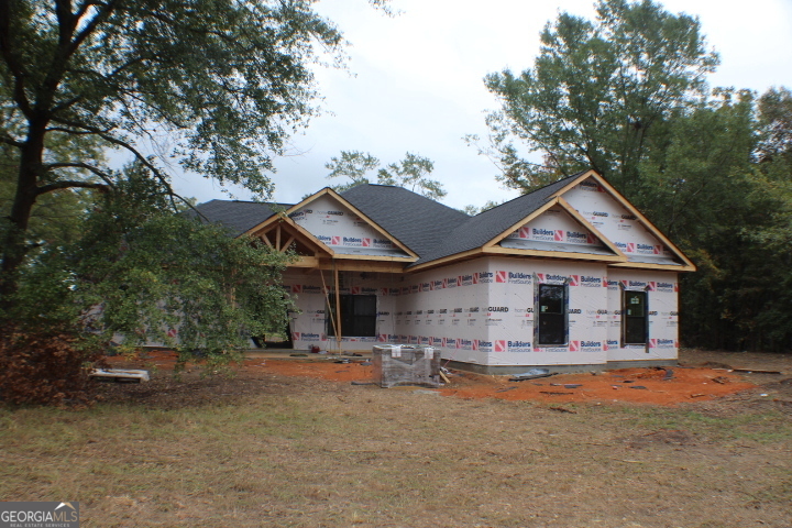 2767 Claxton Dairy Road Dublin, GA 31021 - Photo 3 of 4 a view of a house with a yard and large tree