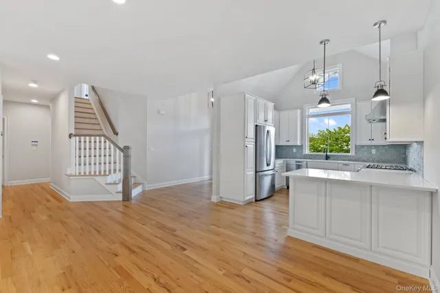 a view of a kitchen with a sink and a window