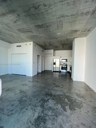 a view of empty room with a flat screen tv