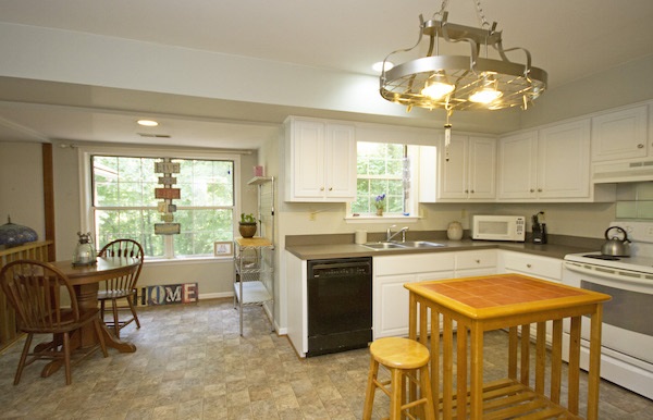 816 Harris Road Charlottesville, VA 22902 - Photo 6 of 28 a kitchen with a stove a sink and cabinets