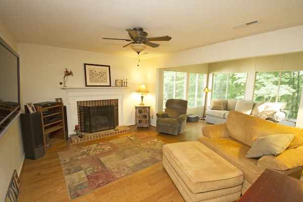 816 Harris Road Charlottesville, VA 22902 - Photo 8 of 28 a living room with furniture large window and a fireplace