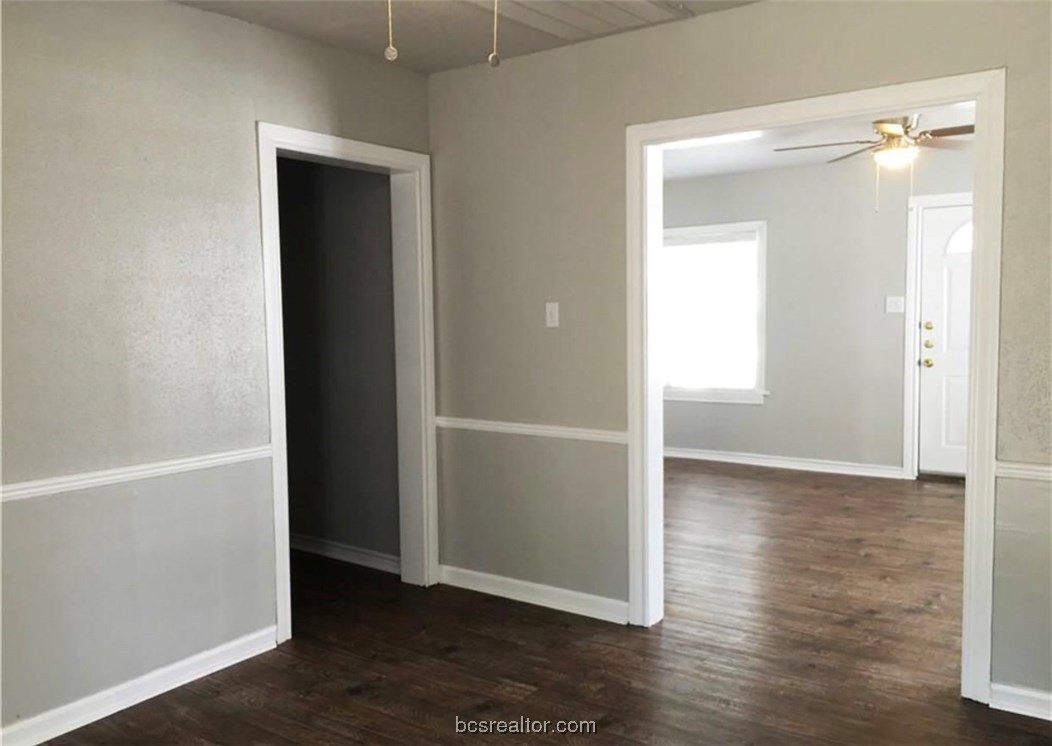 718 Edgewood Drive Bryan, TX 77802 - Photo 5 of 12 an empty room with wooden floor & closet area