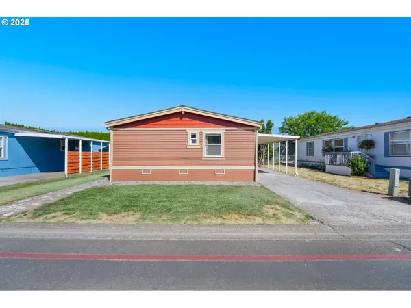 a view of front of house with a yard