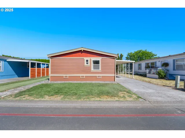 a view of front of house with a yard