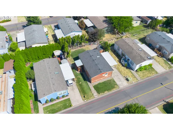 an aerial view of a house with a garden