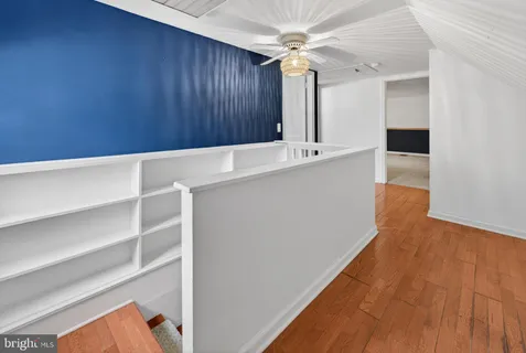 a view of kitchen with cabinets
