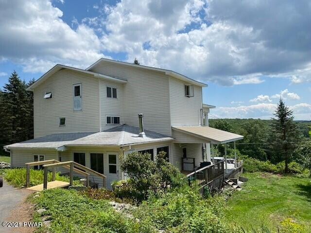 93 Miller Road Beach Lake, PA 18405 - Photo 1 of 53 a backyard of a house with table and chairs