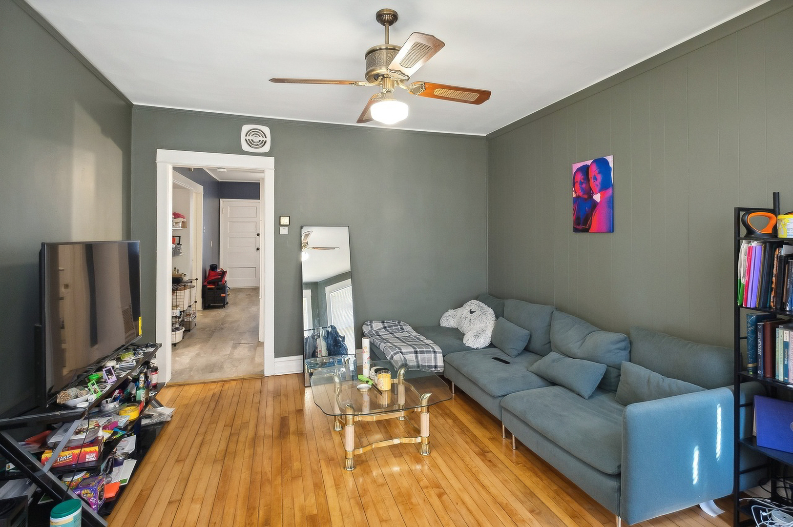 5128 West Henderson Street, Unit 2 Chicago, IL 60641 - Photo 2 of 9 a living room with furniture and wooden floor