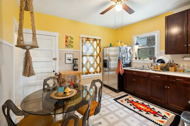 a very nice looking dining room with a table and chairs