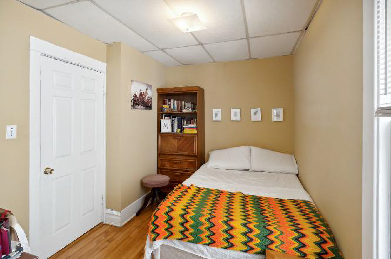 5128 West Henderson Street, Unit 2 Chicago, IL 60641 - Photo 6 of 9 a view of a hallway with wooden floor and a bathroom
