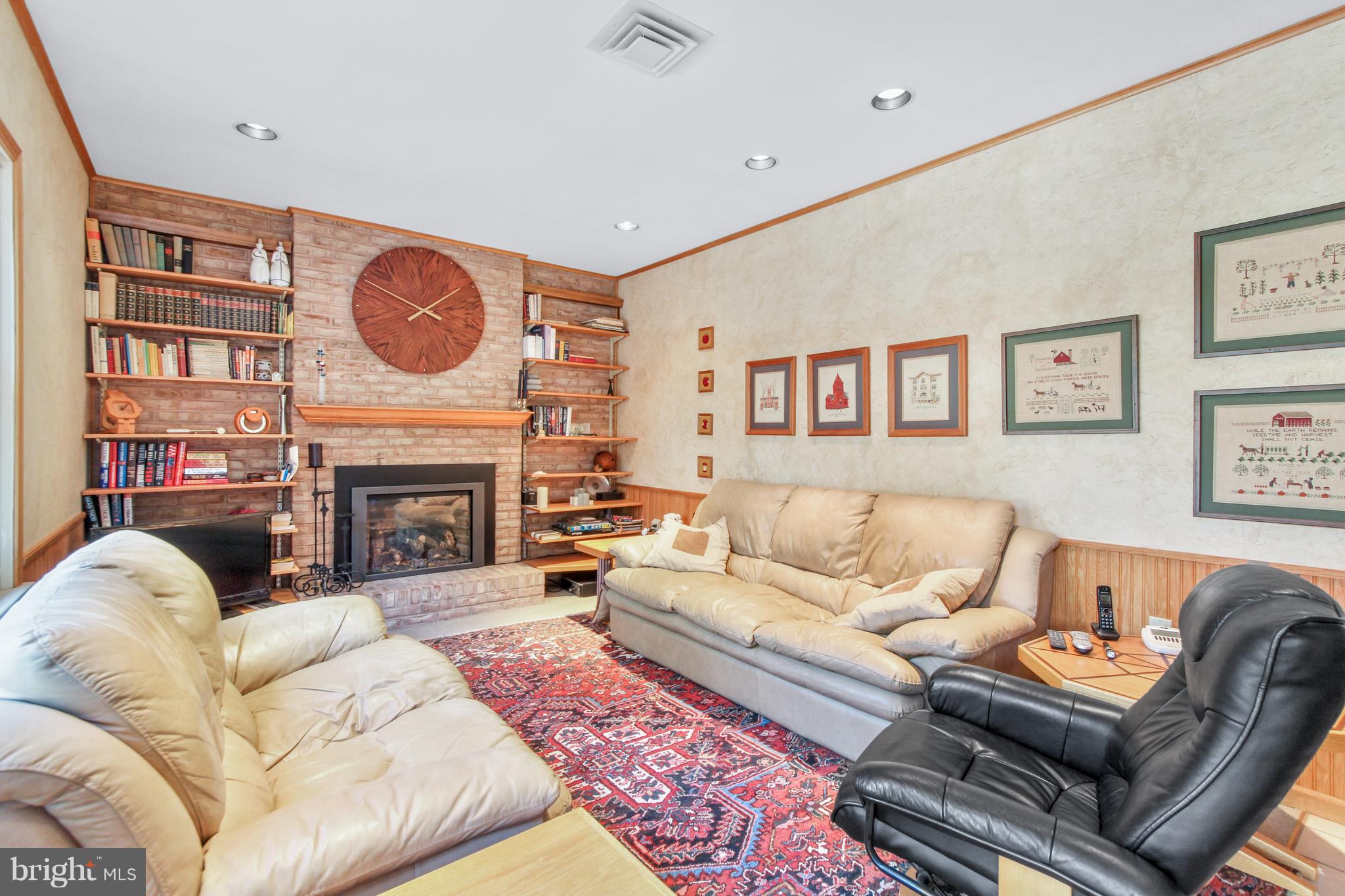 2846 Brookfield Road Lancaster, PA 17601 - Photo 6 of 29 a living room with furniture a fireplace and a large window