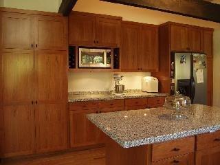 4298 Deer Trail Road Santa Rosa, CA 95404 - Photo 6 of 9 a kitchen with a granite countertop sink and cabinets