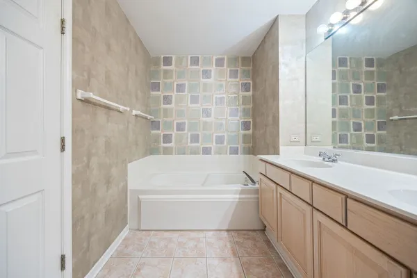 a bathroom with a bathtub and a sink