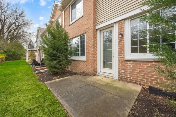 a view of house with backyard and garden