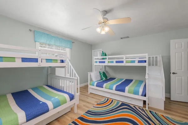 a room with stairs and a wooden floor