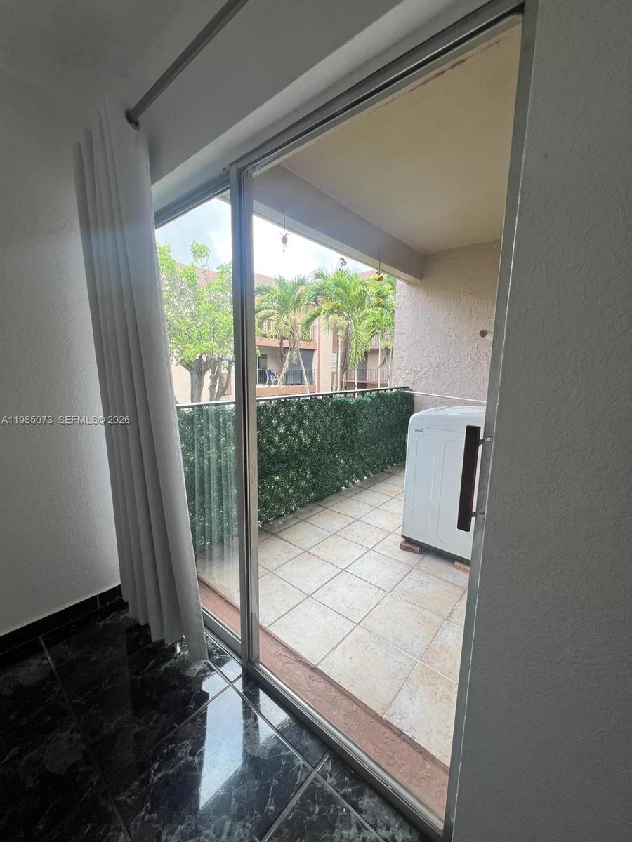 1900 West 68th Street, Unit D207 Hialeah, FL 33014 - Photo 30 of 33 a living room with couch