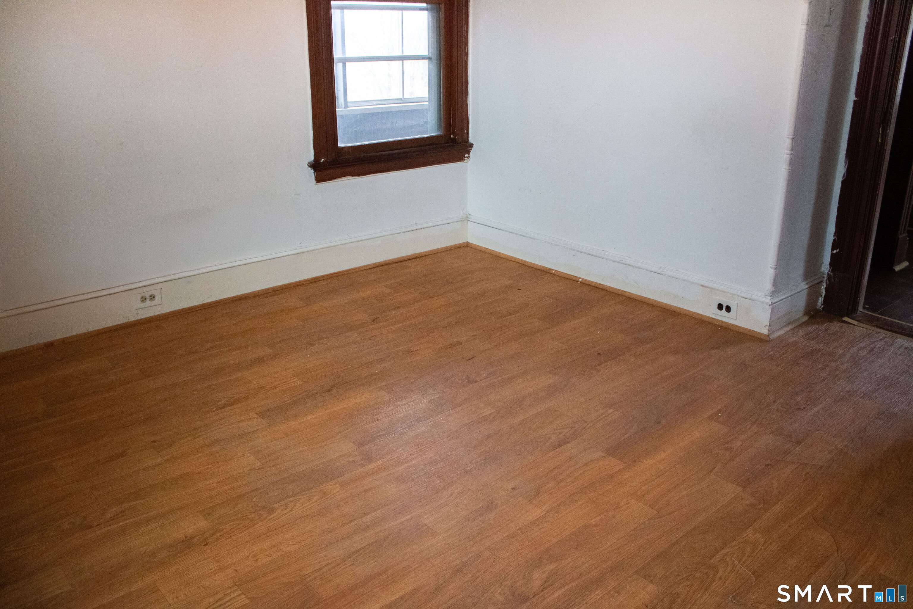 405 Wilson Street, Unit 3 Waterbury, CT 06708 - Photo 5 of 7 an empty room with a window
