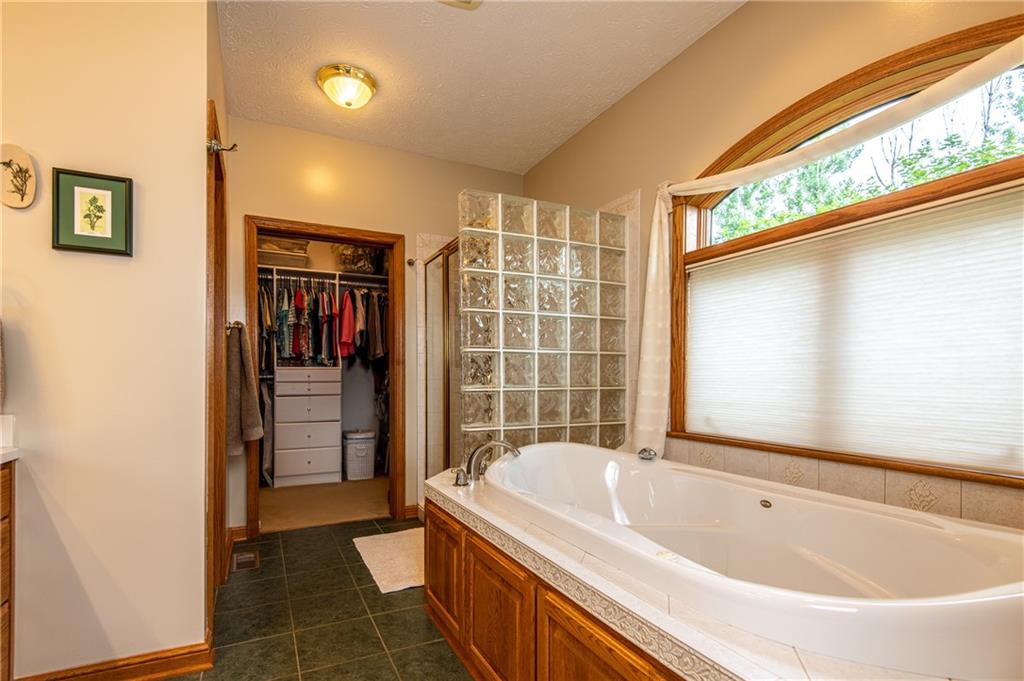 44 Carrier Road Transfer, PA 16154 - Photo 14 of 25 MASTER BATHROOM JETTED TUB, SHOWER, WATERVCLOSET AND WALK IN DRESSING CLOSET WITH BUILT INS.