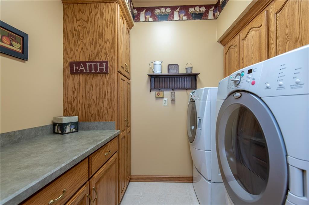 44 Carrier Road Transfer, PA 16154 - Photo 19 of 25 MAIN LEVEL LAUNDRY ROOM, OAK STORAGE AND COUNTER SPACE.