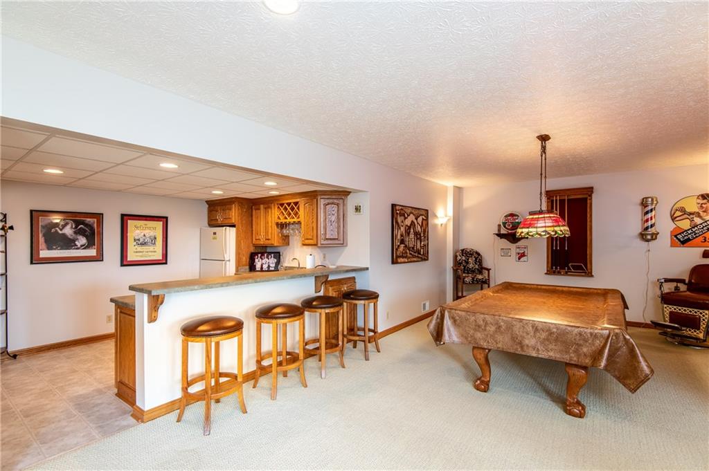44 Carrier Road Transfer, PA 16154 - Photo 20 of 25 LOWER LEVEL GAMEROOM AND WETBAR AREA. PERFECT FOR ENTERTAINING.