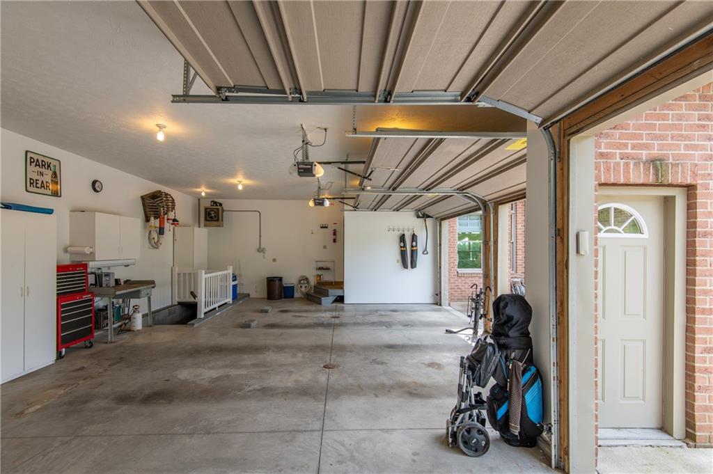 44 Carrier Road Transfer, PA 16154 - Photo 24 of 25 ATTACHED 3 CAR GARAGE WITH HEATER. PLUMBED FOR HOT AND COLD WATER.