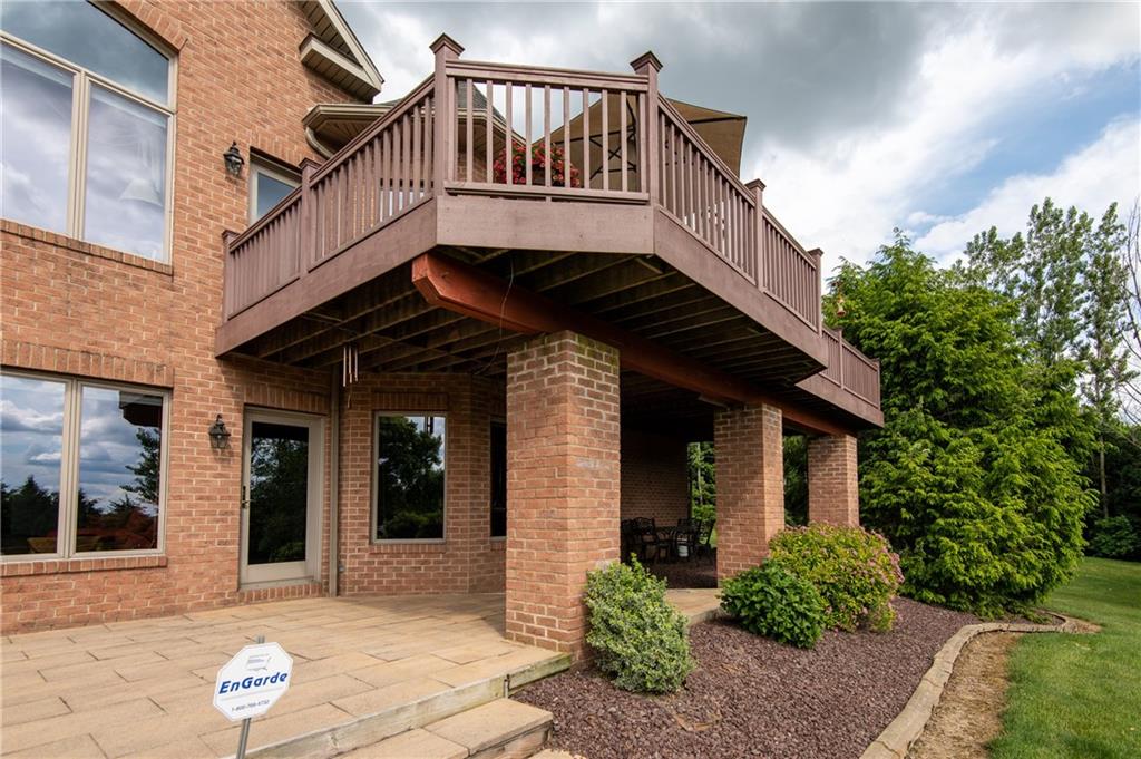 44 Carrier Road Transfer, PA 16154 - Photo 4 of 25 UPPER DECK WIRED FOR SPEAKERS AND HOT TUB SUPPORTED BY BRICK COLUMNS. LOWER LEVEL ACCESS TO STONE PATIO. OUTDOOR LANDSCAPE LIGHTING.