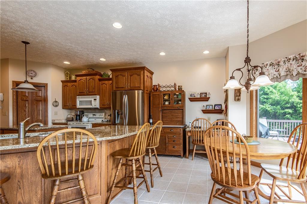 44 Carrier Road Transfer, PA 16154 - Photo 10 of 25 EAT IN KITCHEN WITH SNACK BAR, ISLAND AND DESK SPACE.