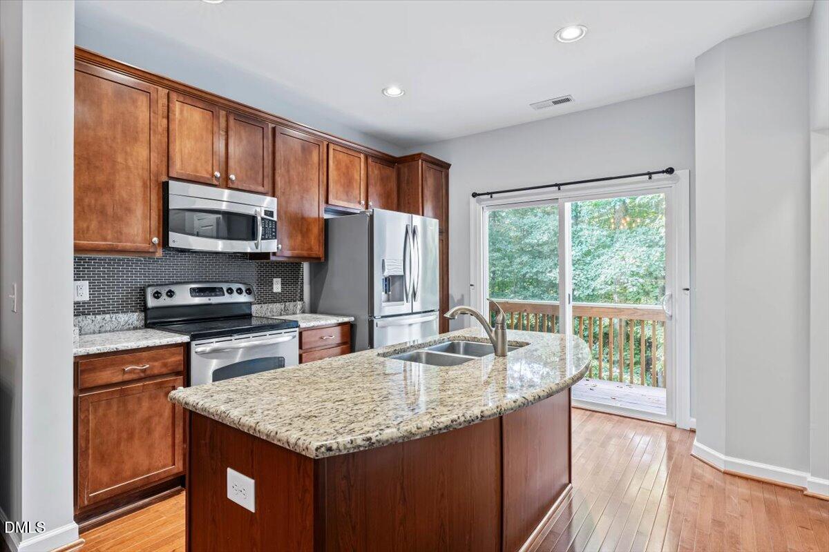 8751 Cypress Grove Run Raleigh, NC 27612 - Photo 11 of 33 main level kitchen