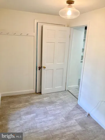 an empty room with wooden floor