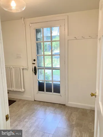 a view of entryway with wooden floor