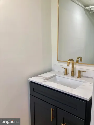 a bathroom with a sink and a vanity
