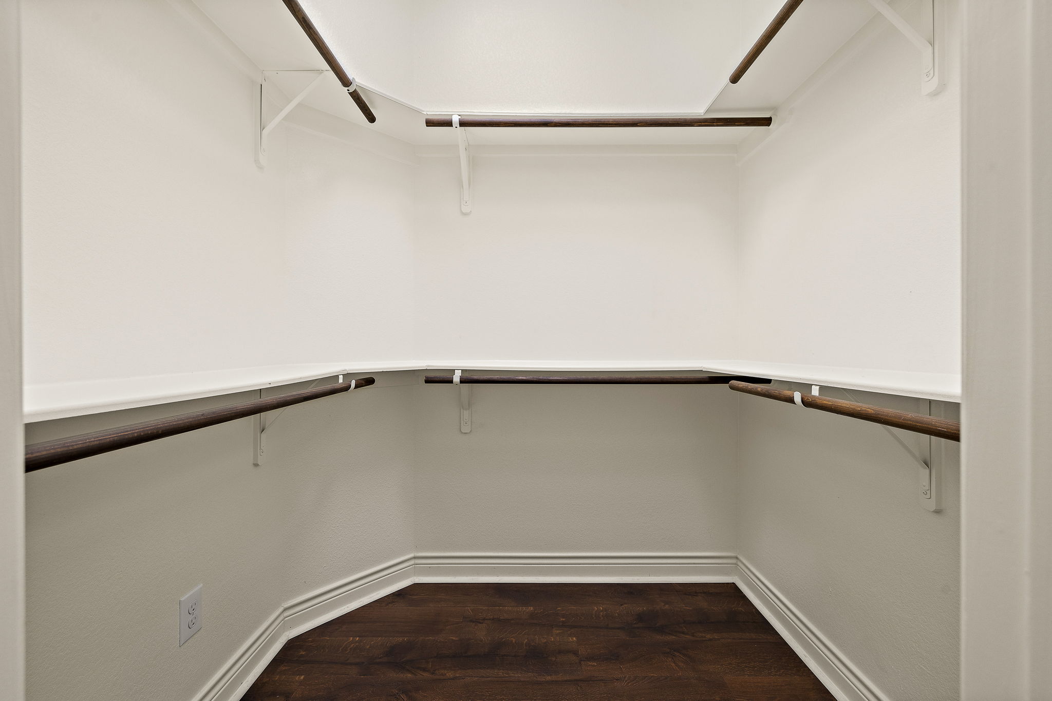 174 Estrella Crossing Georgetown, TX 78628 - Photo 19 of 38 Walk in closet featuring dark wood-type flooring