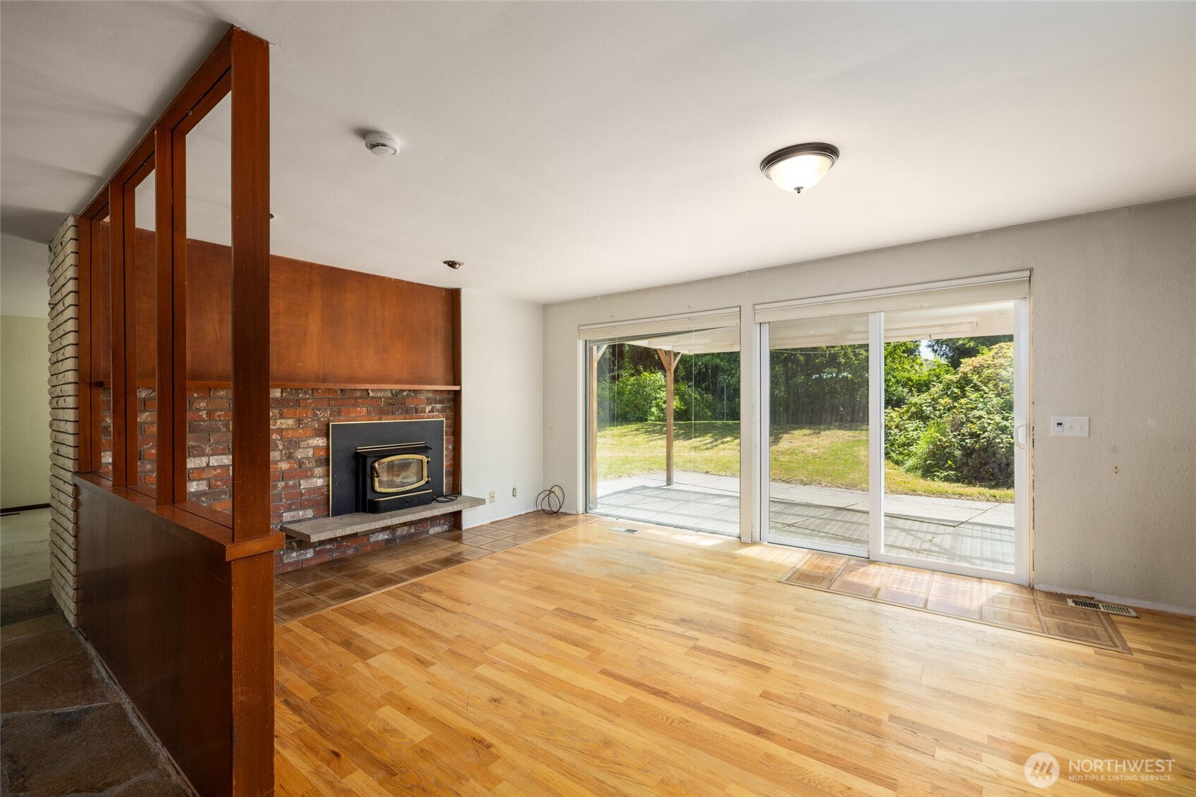 21316 Rolling Ridge Drive Sedro-Woolley, WA 98284 - Photo 5 of 37 a view of an empty room with glass door and balcony