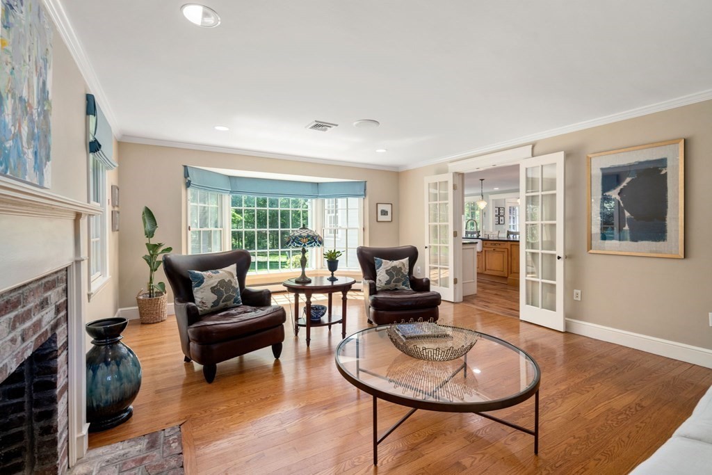 5 Deerfield Road Sherborn, MA 01770 - Photo 12 of 42 a living room with furniture and a fireplace