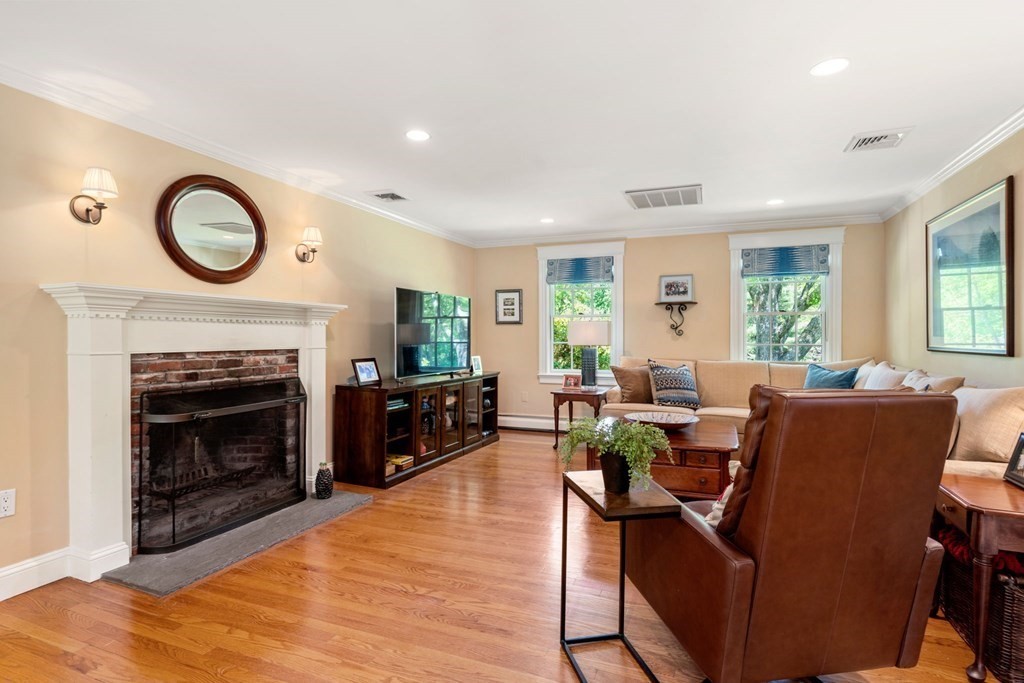 5 Deerfield Road Sherborn, MA 01770 - Photo 16 of 42 a living room with furniture a window and a fireplace