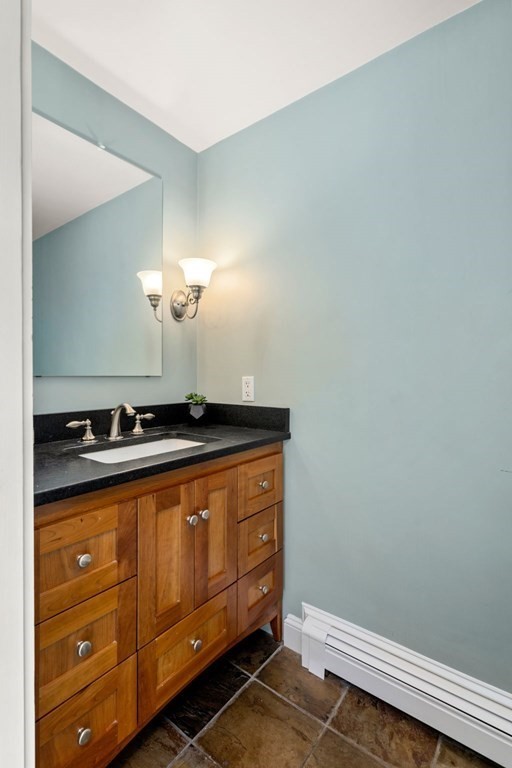 5 Deerfield Road Sherborn, MA 01770 - Photo 21 of 42 a bathroom with a sink and vanity