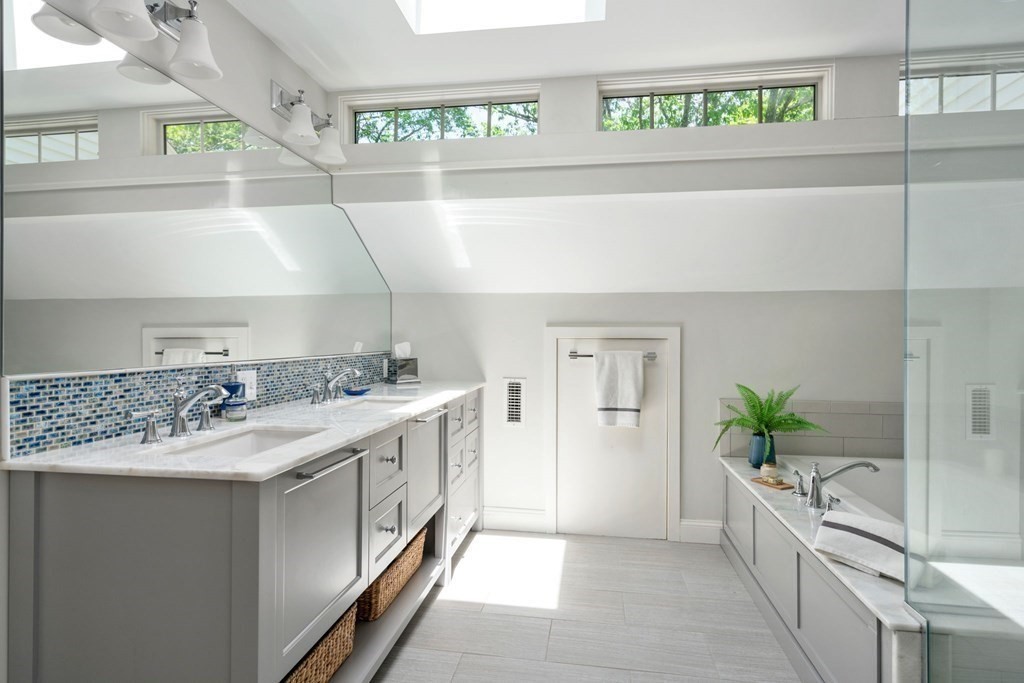 5 Deerfield Road Sherborn, MA 01770 - Photo 27 of 42 a large white kitchen with a granite countertop sink