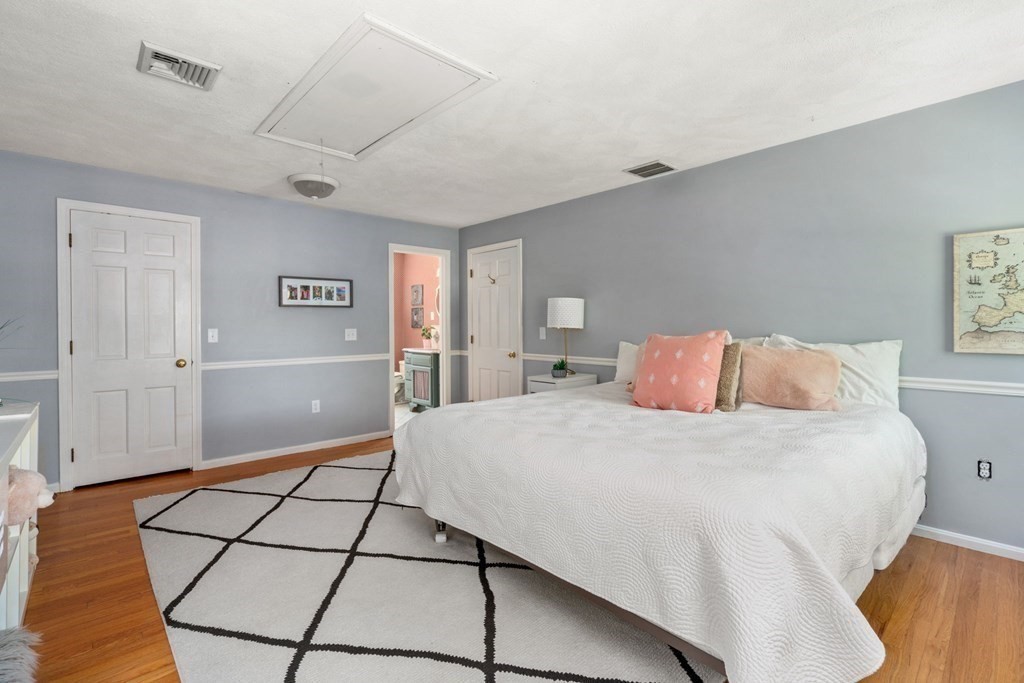 5 Deerfield Road Sherborn, MA 01770 - Photo 29 of 42 a bedroom with a bed and a view of bathroom