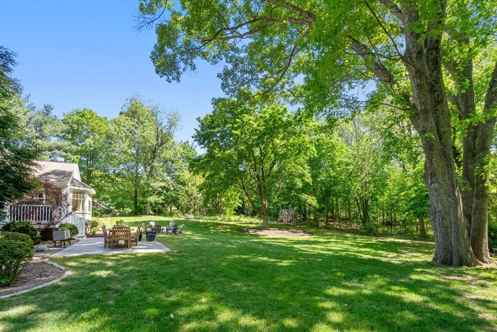 5 Deerfield Road Sherborn, MA 01770 - Photo 4 of 42 a view of yard with swimming pool and trees in the background