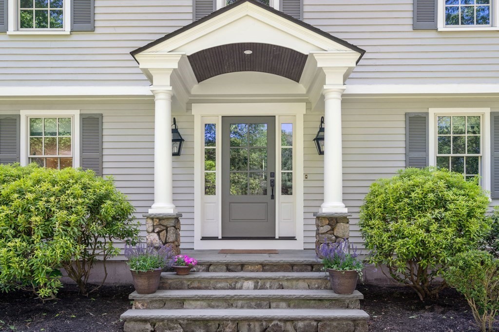 5 Deerfield Road Sherborn, MA 01770 - Photo 5 of 42 a front view of a house with a yard
