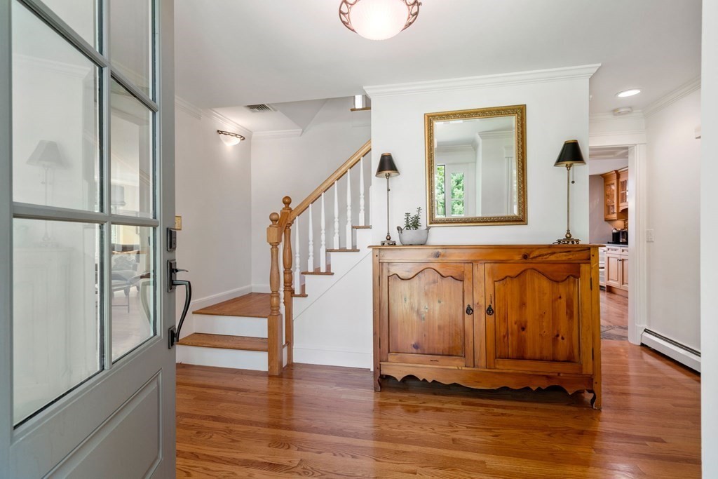 5 Deerfield Road Sherborn, MA 01770 - Photo 6 of 42 a view of entryway with wooden floor and stairs