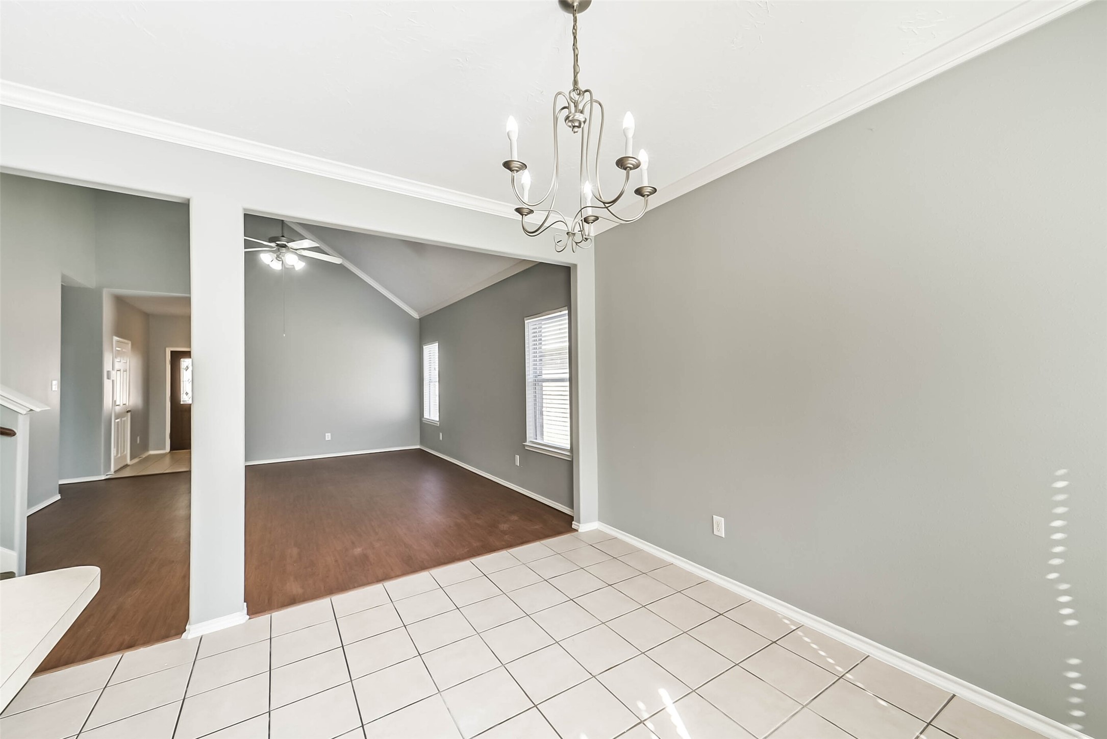 8726 Old Maple Lane Humble, TX 77338 - Photo 14 of 35 wooden floor in an empty room with a chandelier