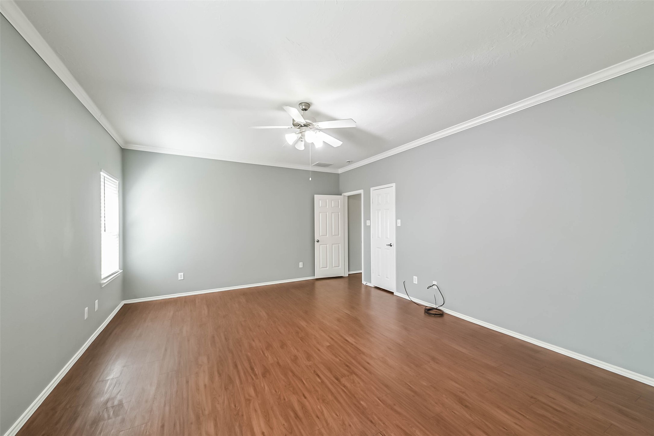 8726 Old Maple Lane Humble, TX 77338 - Photo 17 of 35 wooden floor in an empty room with a window