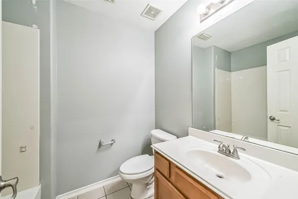 a bathroom with a sink toilet and vanity