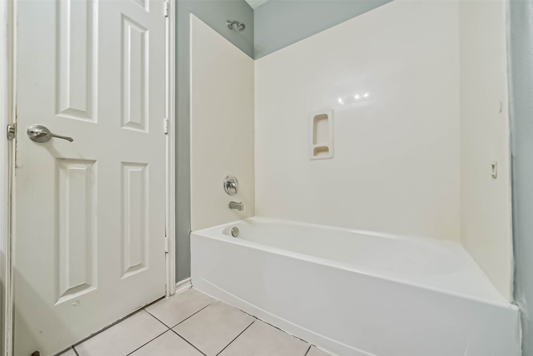 8726 Old Maple Lane Humble, TX 77338 - Photo 30 of 35 a white bath tub sitting next to a shower