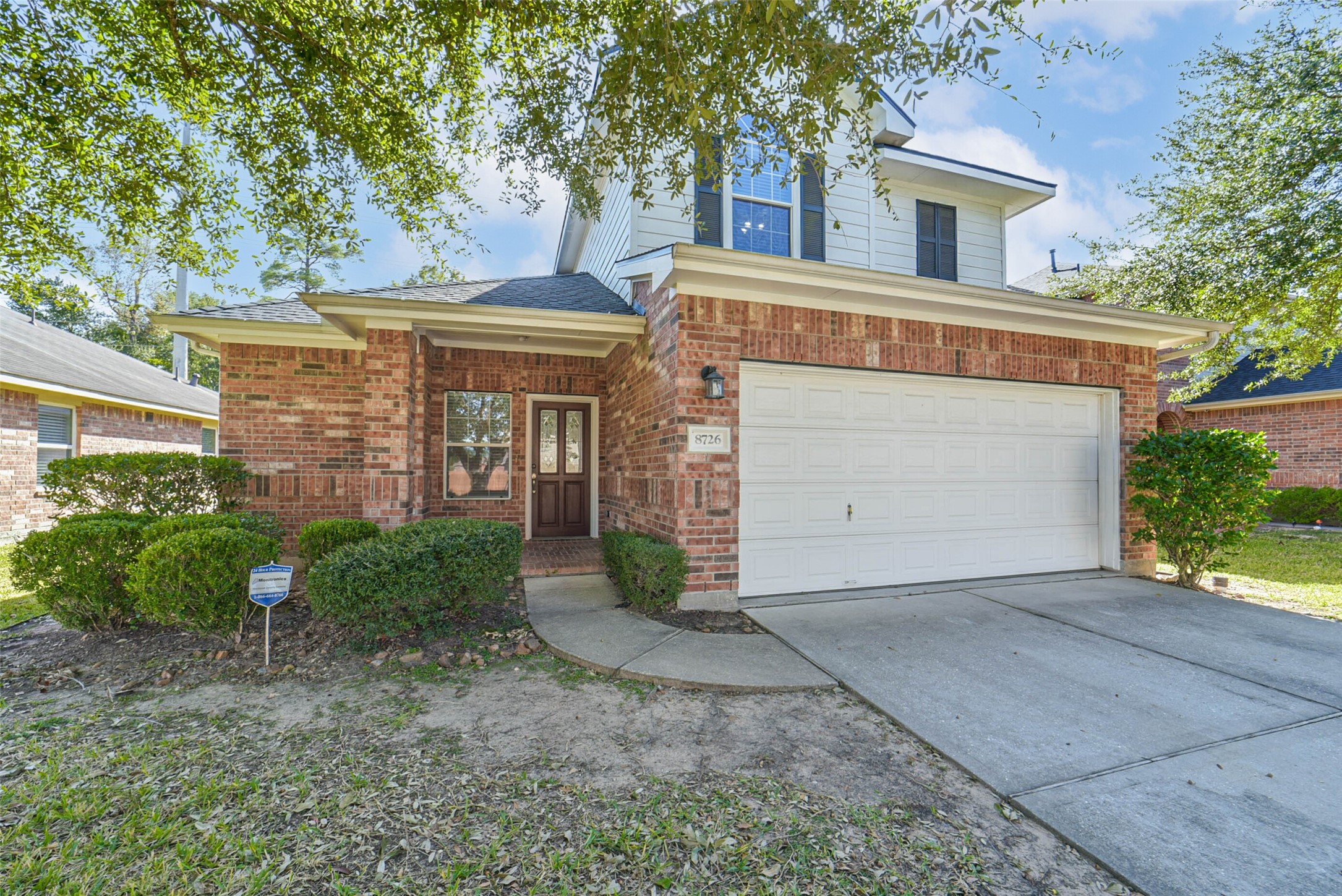 8726 Old Maple Lane Humble, TX 77338 - Photo 33 of 35 front view of a house with a street