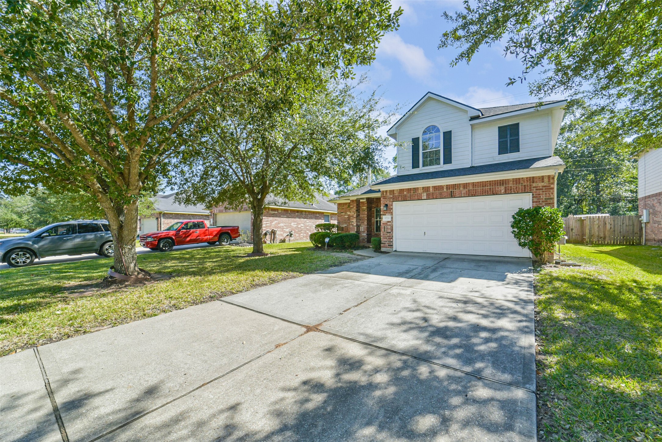 8726 Old Maple Lane Humble, TX 77338 - Photo 35 of 35 a front view of a house with a yard and garage